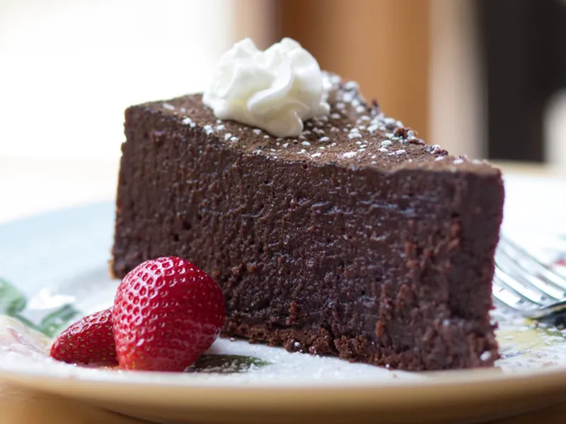 Rich flourless chocolate cake with cream at Blue Ocean Basket, a Fast-Food Restaurant in Hamden